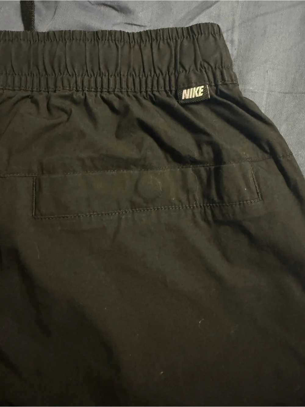 Nike Men's Black Jogger-Style Sweatpants with White Swoosh